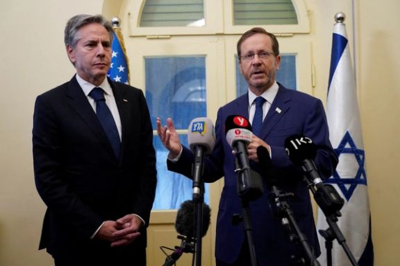 U.S. Secretary of State Antony Blinken and Israel's President Isaac Herzog make statements to the media inside The Kirya, which houses the Israeli Ministry of Defense, in Tel Aviv, Israel, Thursday Oct. 12, 2023.