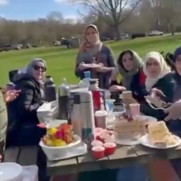 A screengrab from the video of the Iranian ambassador and embassy staff in London picnicking and eating during Ramadan