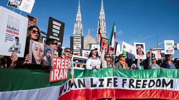 Protestors in support of women in Iran hold a banner reading 'Women Life Freedom' during a protest following the death of Mahsa Amini, in Ottawa, Ontario, Canada, October 29, 2022.