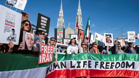 Protestors in support of women in Iran hold a banner reading 'Women Life Freedom' during a protest following the death of Mahsa Amini, in Ottawa, Ontario, Canada, October 29, 2022.