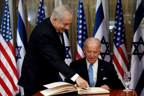 Vice President Joe Biden prepares to sign the guest book with Israel's Prime Minister Benjamin Netanyahu in Jerusalem March 9, 2010.