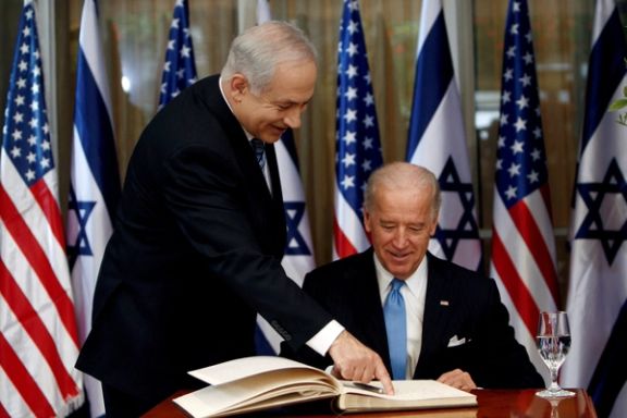 Vice President Joe Biden prepares to sign the guest book with Israel's Prime Minister Benjamin Netanyahu in Jerusalem March 9, 2010.