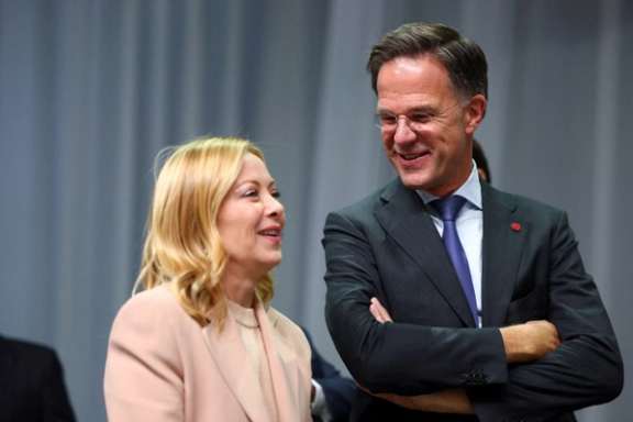 Italian Prime Minister Giorgia Meloni and NATO Secretary General Mark Rutte react as they attend the European Political Community summit in Copenhagen, Denmark, October 2, 2025.