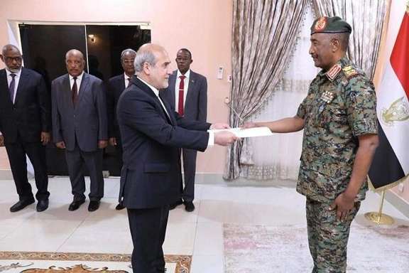 Iran's new ambassador to Sudan Hassan Shah Hosseini presents his credentials to the country's de-facto leader Abdel Fattah al-Burhan on July 21, 2024