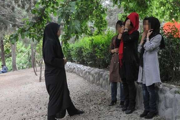 A hijab enforcer confronting women in Iran to fully cover their hair