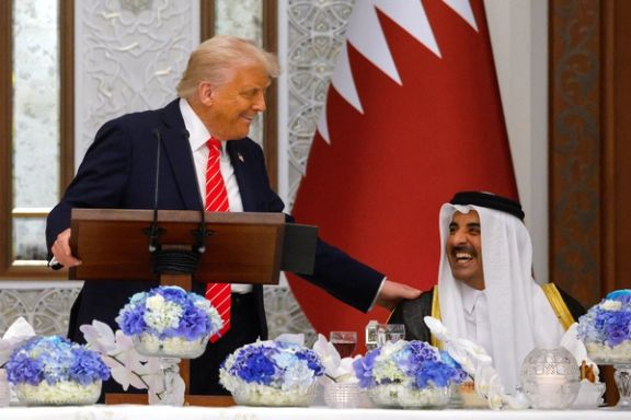 US President Donald Trump speaks next to Qatar's Emir Tamim bin Hamad Al Thani on the day of a state dinner, at Lusail Palace in Lusail, Qatar, May 14, 2025.