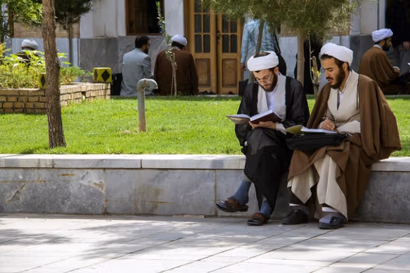 Two young clerics in the courtyard of a seminary. FILE