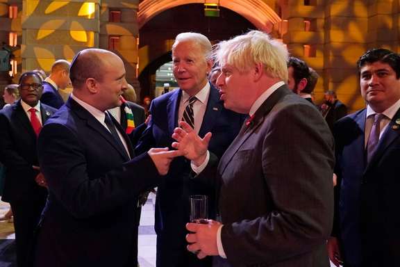 Israel's PM Naftali Bennett, US President Joe Biden and Britain's PM Boris Johnson chat as they attend an evening reception, in Glasgow, Scotland, November 1, 2021.