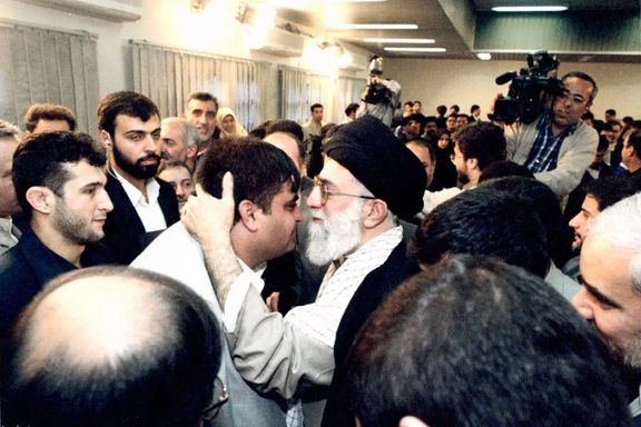 Iran’s ruler Ali Khamenei kissing weightlifting champion Hossein Rezazadeh (undated)