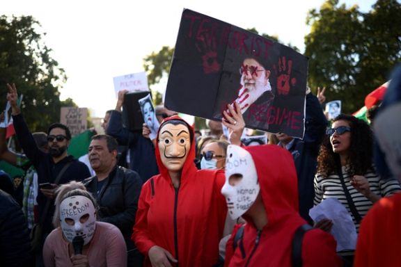 People demonstrate outside the Houses of Parliament during a protest against the Islamic regime of Iran following the death of Mahsa Amini, in central London, Britain, October 8, 2022.