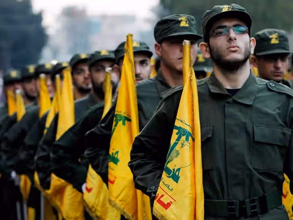 Hezbollah fighters marching in Lebanon. FILE PHOTO