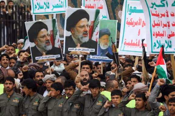 Houthi supporters hold up posters of late Iranian President Ebrahim Raisi as they rally to show solidarity with Palestinians in Gaza, in Sanaa, Yemen May 24, 2024.