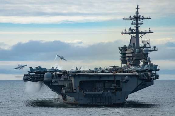 Two F/A-18 Super Hornets, assigned to Carrier Air Wing (CVW) 11, launch from the flight deck of the aircraft carrier USS Theodore Roosevelt (CVN-71) on April 29, 2021.
