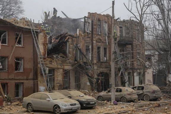 Emergency service members work at a residential building destroyed during a Russian missile and drone strike, amid Russia's attack on Ukraine, in Odesa, Ukraine December 29, 2023.