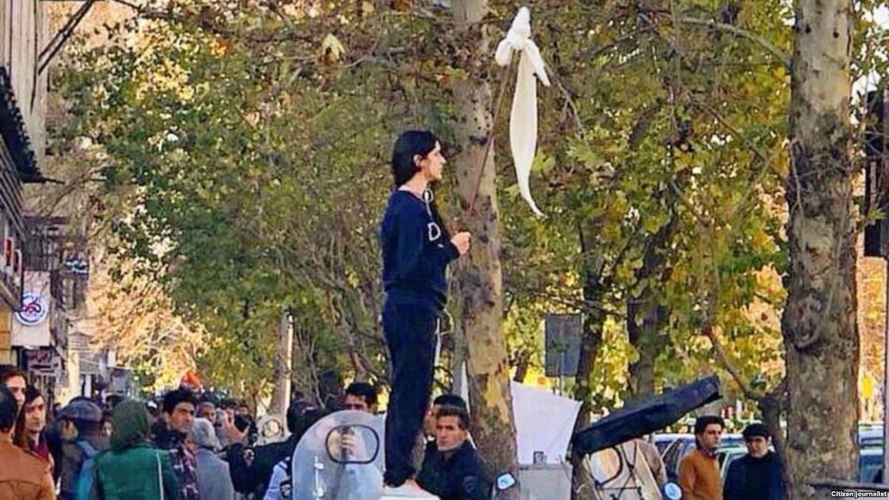 Vida Movahed protesting against compulsory hijab in Tehran in December 2017