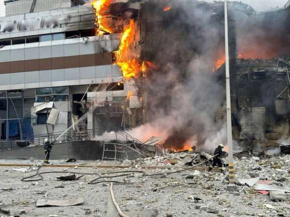 Firefighters work at the site where a shopping mall was heavily damaged by a Russian missile strike, amid Russia's attack on Ukraine, in Dnipro, Ukraine December 29, 2023.
