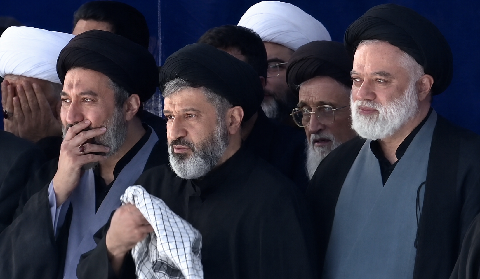 (From right) Mostafa, Masoud and Meysam Hosseini Khamenei, three sons of Ali Khamenei, attend prayers over their father's body on Sunday. 