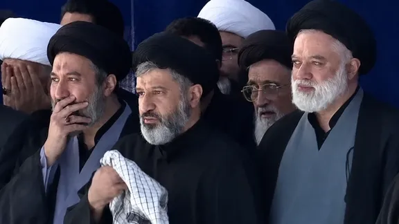 (From right) Mostafa, Masoud and Meysam Hosseini Khamenei, three sons of Ali Khamenei, attend prayers over their father's body on Sunday.