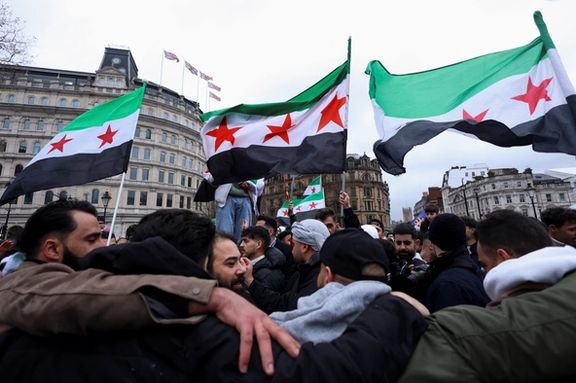 People wave Syrian opposition flags as they gather in Trafalgar Square, after Syrian rebels announced that they have ousted Syria's Bashar al-Assad, in London, Britain December 8, 2024.