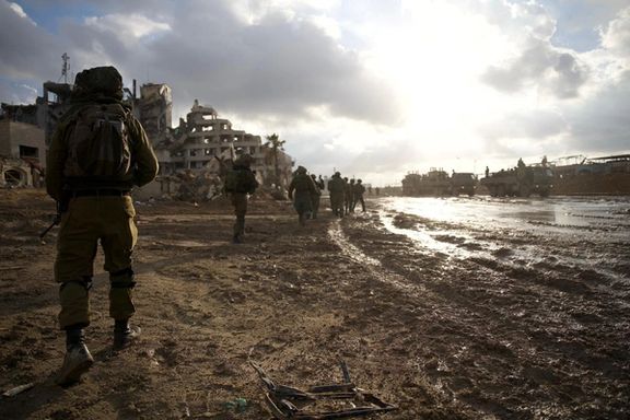 Israeli soldiers operate in the Gaza Strip amid the ongoing conflict between Israel and the Palestinian Islamist group Hamas, in this handout picture released on December 31, 2023.