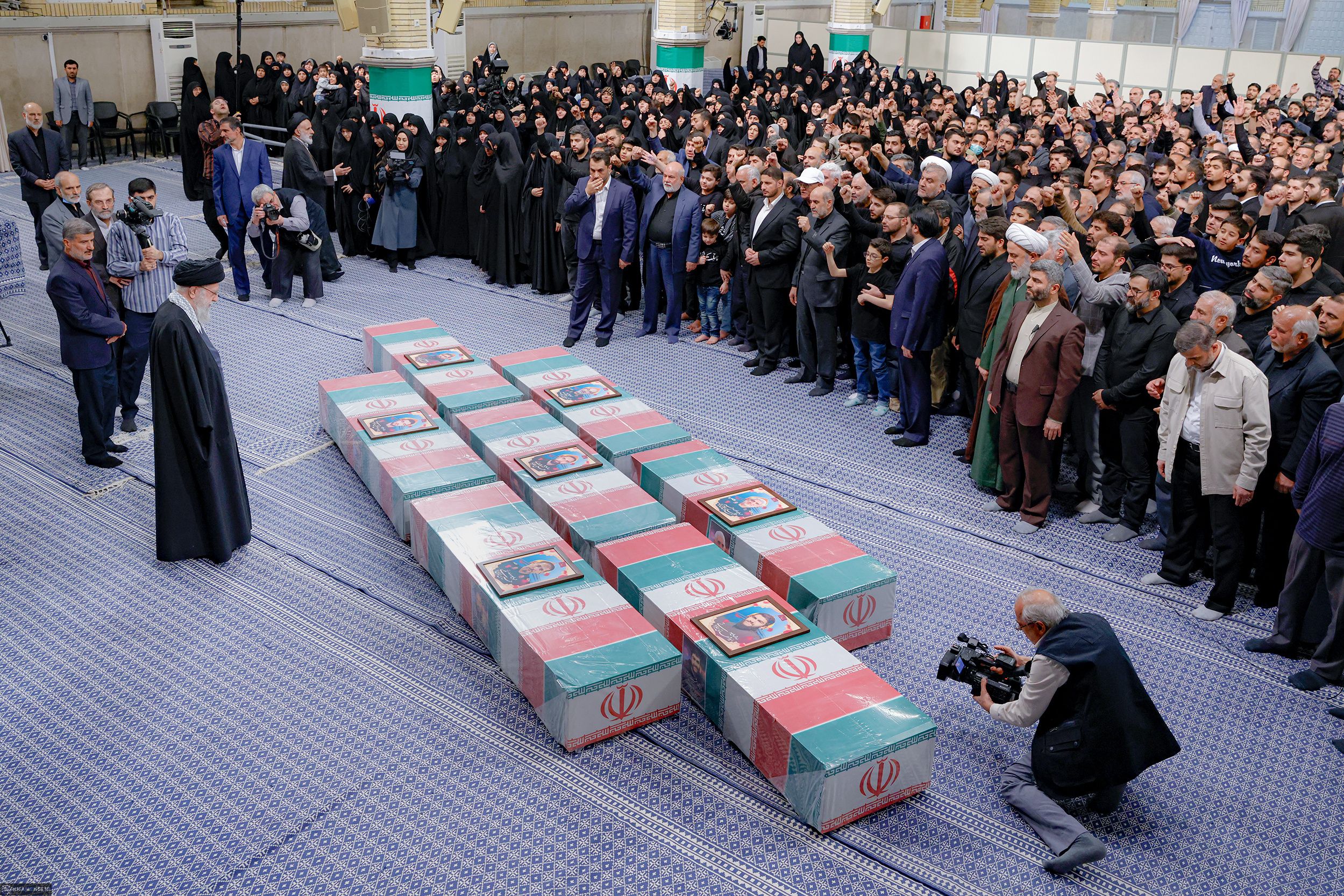 Iran's Supreme Leader Ali Khamenei looks at the coffins of members of the Islamic Revolutionary Guard Corps who were killed in the Israeli airstrike on the Iranian embassy complex in the Syrian capital Damascus, during a funeral ceremony in Tehran, Iran April 4, 2024. 
