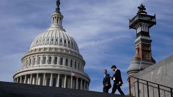 People walk past the US Capitol building in Washington, November 15, 2023.