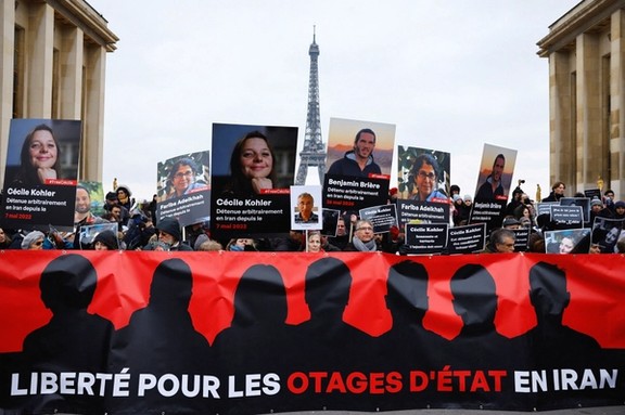 Supporters and relatives of French citizens detained in Iran, Cecile Kohler, Benjamin Briere, Jacques Paris and Fariba Adelkhah, gather in front of the Eiffel Tower, during a rally demanding their release, in Paris, France, January 28, 2023.