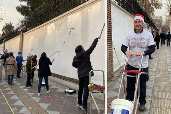 Volunteers In Iran Wipe Anti-UK Slogans Off Embassy Walls