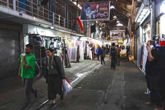 People walk in Tehran's Grand Bazaar, April 2026