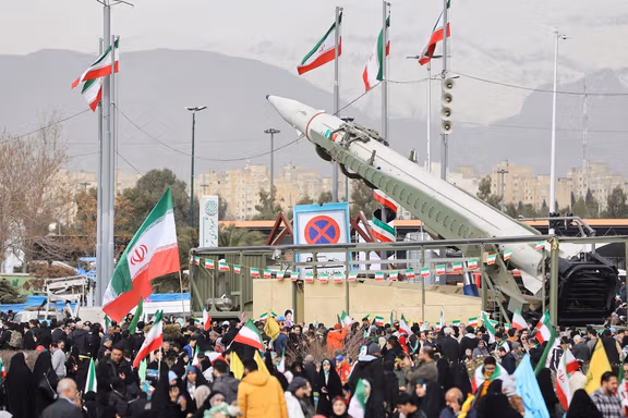 People gather near a missile on display during the 47th anniversary of the Islamic Revolution in Tehran, Iran February 11, 2026.
