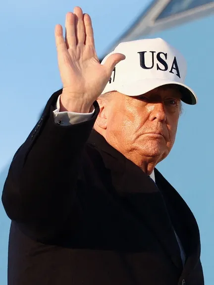 US President Donald Trump waves as he boards Air Force One for travel to Florida, at Joint Base Andrews, Maryland, US, March 13, 2026