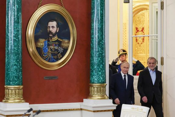 Russian President Vladimir Putin and Iranian President Masoud Pezeshkian arrive for a ceremony to sign an agreement of comprehensive strategic partnership between the two countries, at the Kremlin in Moscow, Russia January 17, 2025.