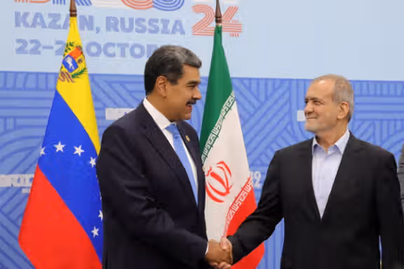 Venezuelan President Nicolas Maduro shakes hands with Iranian President Masoud Pezeshkian on the sidelines of the BRICS summit in Kazan, Russia October 24, 2024.