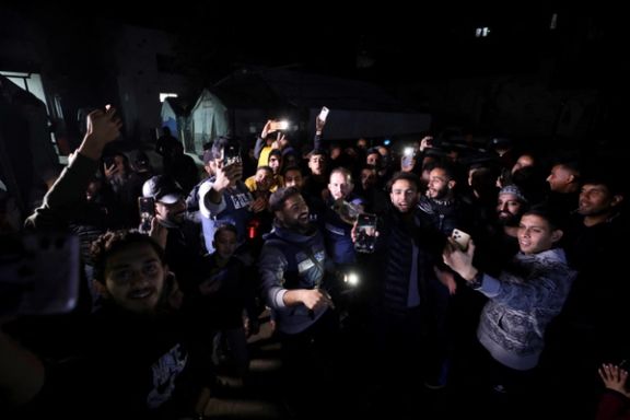 Palestinians and journalists react to news on a ceasefire deal with Israel, in Gaza City, January 15, 2025.