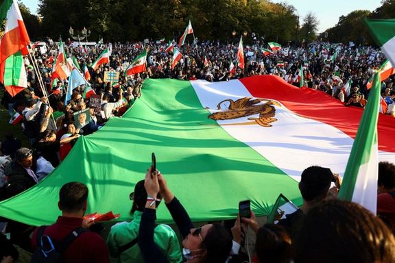 Tens of thousands of Iranian rallying in Berlin unfurled a large Iranian pre-revolution national flag with a lion in the middle, as opposed to the Islamic Republic emblem.