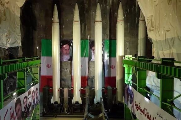 Iranian missiles with images of Islamic Republic leaders in the background
