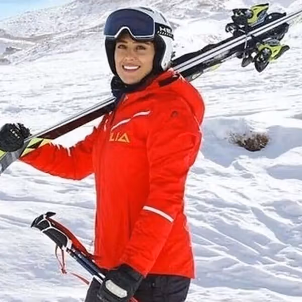 Iranian skier who had fled to Germany makes homecoming, praises Khamenei