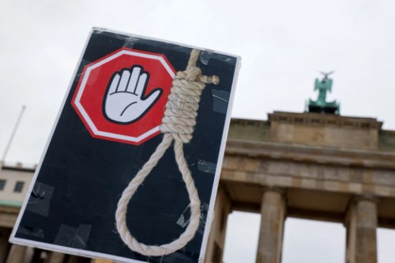 A placard is seen during a protest against the Islamic Republic in Berlin, Germany, 2022.