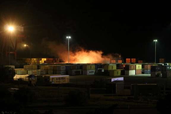 moke rises from a fire in a container storage area after an Israeli air strike on the Syrian port of Latakia on December 7, 2021.