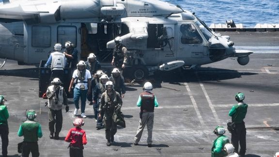 Sailors from the Dwight D. Eisenhower Carrier Strike Group assist distressed mariners rescued from the Liberian-flagged, Greek-owned bulk carrier M/V Tutor that was attacked by Houthis, in the Red Sea, June 15, 2024.
