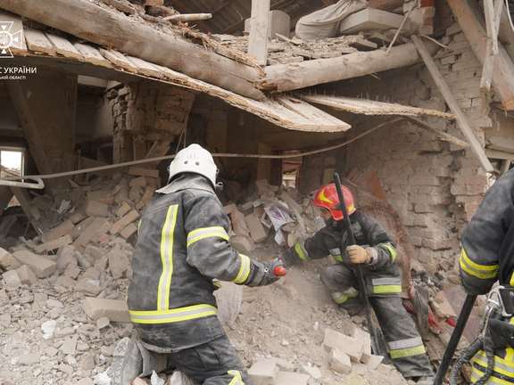Rescuers work at a site of residential buildings destroyed by a Russian missile strike, in Lviv region. March 9, 2023