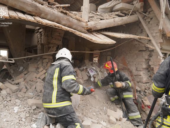 Rescuers work at a site of residential buildings destroyed by a Russian missile strike, in Lviv region. March 9, 2023