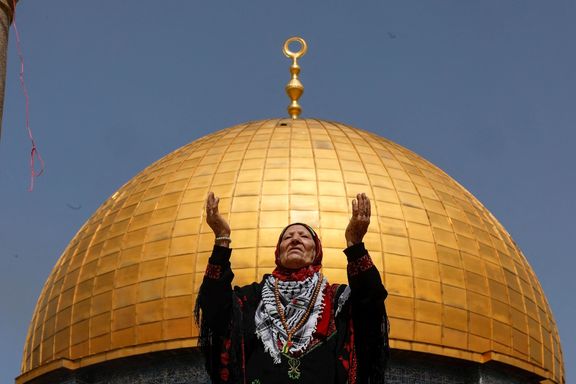A woman prays as Palestinian Muslims attend Friday prayers of the Muslim holy month of Ramadan, on the compound known to Muslims as the Noble Sanctuary and to Jews as the Temple Mount, in Jerusalem's Old City, April 7, 2023.