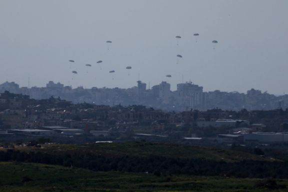 Packages fall towards northern Gaza, after being dropped from a military aircraft, amid the ongoing conflict between Israel and the Palestinian group Hamas, as seen from Israel's border with Gaza, in southern Israel, March 11, 2024.