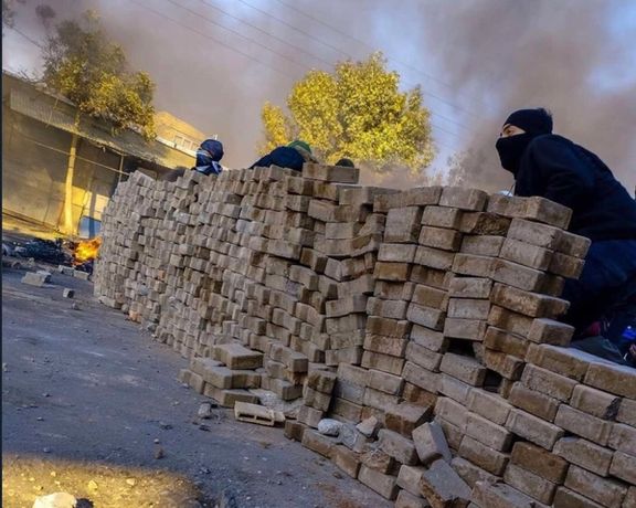 Protesters have set up a barricade in Mahabad, western Iran on Nov. 19, 2022