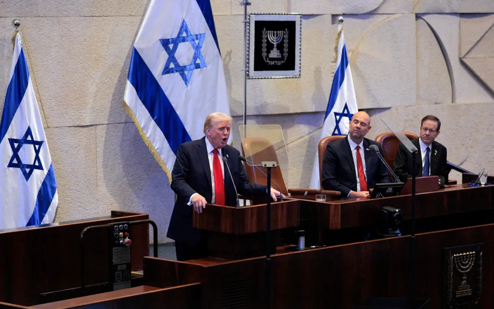 US President Donald Trump addresses Israel's parliament on October 13, 2025.
