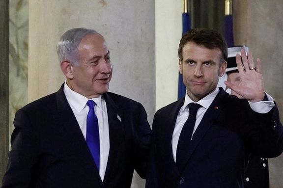 French President Emmanuel Macron welcomes Israeli Prime Minister Benjamin Netanyahu as he arrives for a dinner at the Elysee Palace, in Paris, France, February 2, 2023.