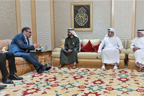 Iran's Supreme National Security Council secretary Ali Shamkhani (left) and UAE Vice President Mohammed bin Rashid Al Maktoum (center)