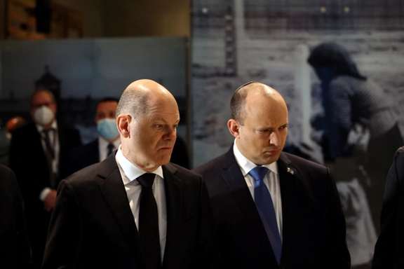German Chancellor Olaf Scholz stands next to Israeli Prime Minister Naftali Bennett visiting Yad Vashem Holocaust Remembrance Center in Jerusalem, March 2, 2022.