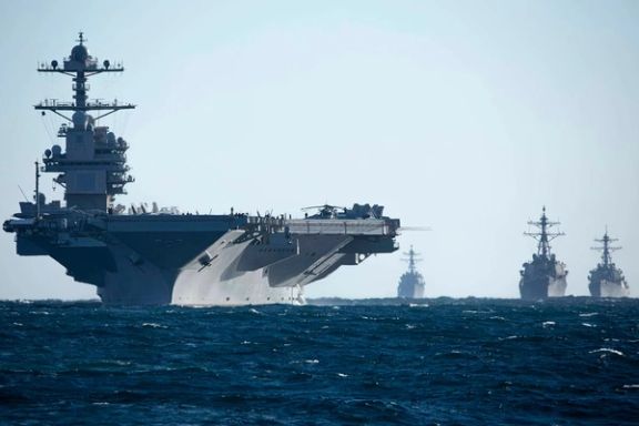 The aircraft carrier Gerald R. Ford and destroyers Thomas Hudner, Ramage and McFaul conduct a drill while underway in the Atlantic Ocean